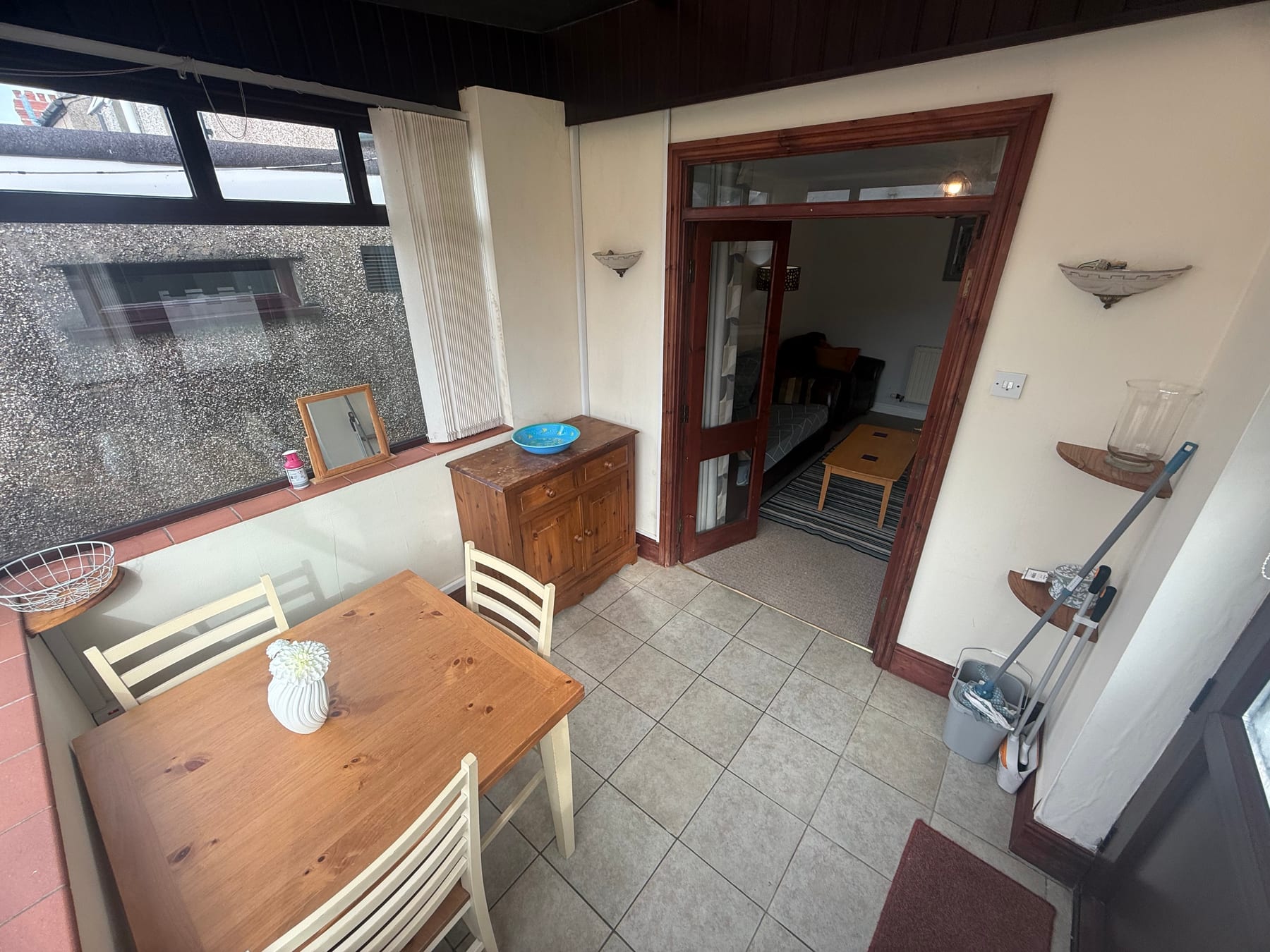Dining table and chairs in the conservatory at 40 Orme Road